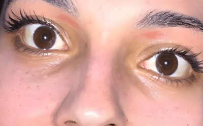 A Close Up Of A Person With Brown Eyes